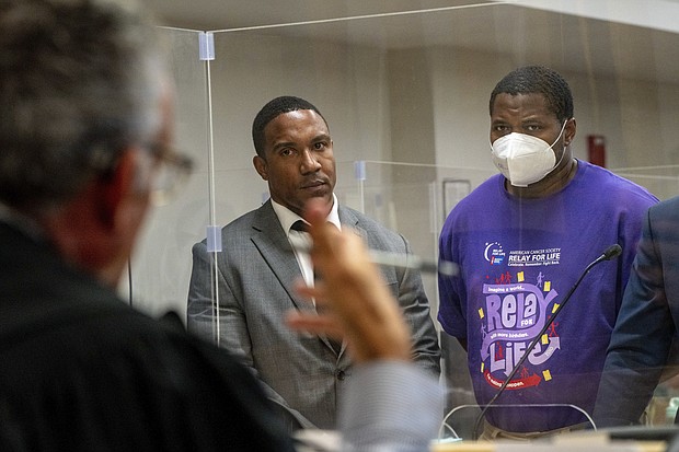 An off-duty New York City correction officer accused of fatally shooting a teenager in the face was indicted on murder and manslaughter charges on August 22. Dion Middleton, right, is seen here at the Bronx Criminal court on July 22.
Mandatory Credit:	David Dee Delgado/The New York Times/Redux