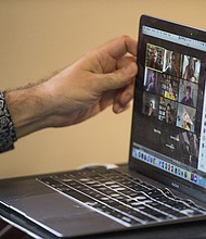 Zoom shares plunged more than 10% on August 23. A PhD candidate at Harvard tilts his screen while teaching an online class in April of 2020 in Cambridge, Massachusetts.
Mandatory Credit:	Blake Nissen/The Boston Globe/Getty Images