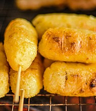 Khao jee: Sticky rice coated with eggs and grilled over a charcoal stove.
Mandatory Credit:	Chay/Adobe Stock