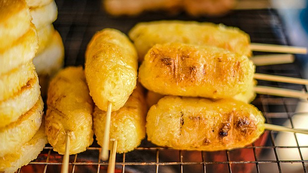 Khao jee: Sticky rice coated with eggs and grilled over a charcoal stove.
Mandatory Credit:	Chay/Adobe Stock