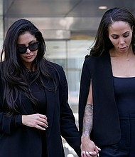 Vanessa Bryant, left, is seen leaving the federal courthouse in Los Angeles on August 19. Closing arguments are underway August 23 in Bryant's civil rights lawsuit against Los Angeles County that is centered on the photos taken by first responders of the helicopter crash site that killed her husband, NBA legend Kobe Bryant, and daughter Gianna, along with seven others.
Mandatory Credit:	Damian Dovarganes/AP