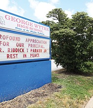 A sign outside the school shows the tremendous loss felt by teachers, students, staff and the Richmond community.