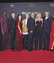 From left, Fabian Frankel, Milly Alcock, Steve Toussaint, Matt Smith, Olivia Cooke, Emma D’Arcy, Paddy Considine, Eve Best, Rhys Ifans, Emily Carey and Graham McTavish pose for photographers Aug. 15 upon arrival for the premiere of the TV series “House of the Dragon” in London.