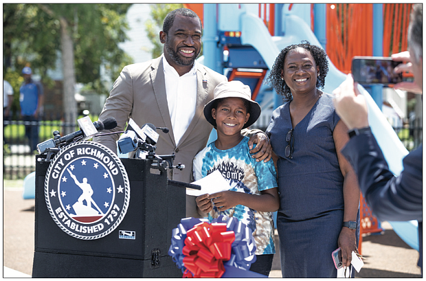 Skylar Hayden, who will be in third grade this fall at Henry L. Marsh III Elementary School this year, is shown with Mayor Levar M. Stoney and Marsh Elementary Principal Kimberly Cook during the Aug. 18 unveiling of the school’s new playground. Skylar said the mayor “works hard to make sure students like me have the tools we need to be successful. We have a new school and now a new playground. Thank you, Mayor Stoney.”