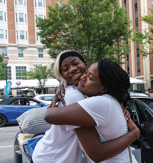 Last weekend, new and returning students and their families filled the streets at Virginia Commonwealth University’s Monroe Park Campus for the annual move-in weekend. What did the students have in tow? “Mini fridges, TVs, boxes of snacks, piles of clothes and all manner of creature comforts they’ll want and need for the new academic year,” according to VCU’s news website. Hillary Amaniampong of Dumfries and her mom bid a brave farewell to one another as Ms. Amaniampong, a nursing major, moves into a VCU dormitory on Franklin Street on Aug. 20.