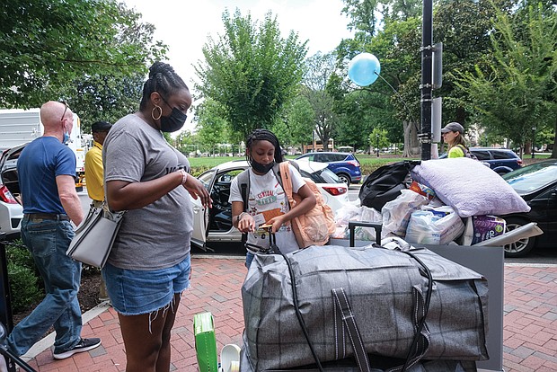 VCU freshman Laiana Trotter of Baltimore got help from her mom, Monique Totter, while moving into Gladding Resident Center. Ms. Trotter will major in pre-nursing. Nearly 4,200 first-year students have started classes at VCU for the fall semester.