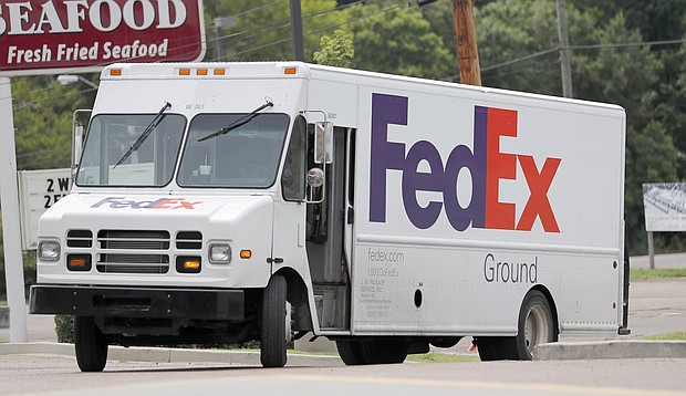 People hoping to get their holiday shopping delivered on time could be caught in the middle of a growing battle between FedEx and thousands of contractors who deliver most FedEx packages.
Mandatory Credit:	Rogelio V. Solis/AP