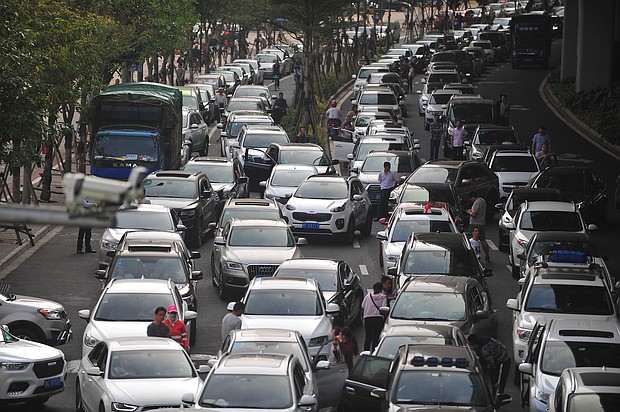 A Chinese island plans to ban the sales of fossil fuel-powered vehicles by 2030.
Mandatory Credit:	Wang Di/Imaginechina/AP