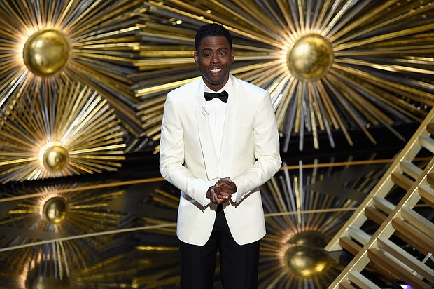Chris Rock says he was asked to host the Academy Awards next year after he was slapped on stage by fellow actor Will Smith while presenting an award on stage at the ceremony in March.
Mandatory Credit:	Kevin Winter/Getty Images North America/Getty Images