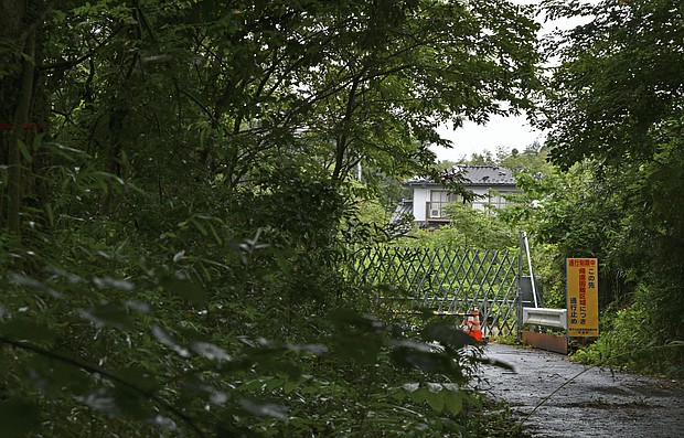 A barricade bars entry to a designated area in the Fukushima prefecture town of Futaba, northeastern Japan, on August 30.
Mandatory Credit:	Kyodo News/Getty Images