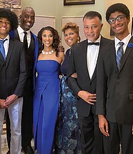 Dr. Tinina Cade (third from right) is shown with members of her family from left, Simone Hammond, Kai Hammond, Dr. Jason Hammond, Dr. Camille Hammond, Dr. Ronald Cade, and Aaron Hammond.