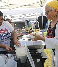 Ana Edwards, right, of Richmond samples culinary delights from Minty’s Catering during the 19th annual Happily Natural Festival + Garden EXPO on Richmond’s South Side on Aug. 27.