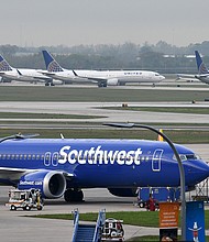 The pilot of a Southwest Airlines flight threatened to cancel takeoff after someone on the plane sent a naked photograph to other passengers. A Southwest Airlines Boeing 737 MAX 8 is pictured in Houston in March of 2019.
Mandatory Credit:	Loren Elliott/Reuters