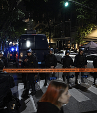 Police are pictured outside the home of Argentine Vice-President Cristina Fernandez de Kirchner after a man pointed a gun at her in Buenos Aires on September 1.
Mandatory Credit:	Luis Robayo/AFP/Getty Images
