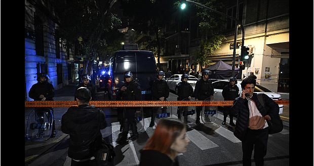 Police are pictured outside the home of Argentine Vice-President Cristina Fernandez de Kirchner after a man pointed a gun at her in Buenos Aires on September 1.
Mandatory Credit:	Luis Robayo/AFP/Getty Images