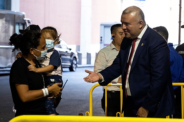 Manuel Castro greets migrants exiting a bus from Texas at the Port Authority on August 30. Castro himself crossed the US-Mexico border with his mother when he was 5.
Mandatory Credit: Yuki Iwamura/Bloomberg/Getty Images