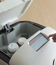 Customers receive a PIN code, enabling them to open the hatch in Rice's "head" to retrieve their drinks.
Mandatory Credit:	Rice Robotics