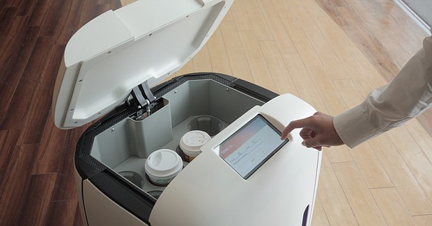 Customers receive a PIN code, enabling them to open the hatch in Rice's "head" to retrieve their drinks.
Mandatory Credit:	Rice Robotics