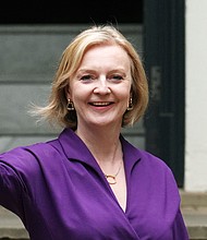 New Conservative Party leader and incoming prime minister Liz Truss waves as she leaves Conservative Party Headquarters on September 5 in London. The Conservative Party have elected Truss as their new leader replacing Boris Johnson.
Mandatory Credit:	Carl Court/Getty Images