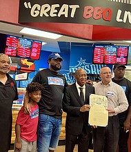 Mayor Turner helps open up the third location for Burn's Original BBQ with Burn’s Original BBQ owner Cory Crawford and family