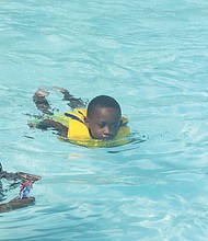 Loretta Lawrence and her grandson, Khalif Fitch, 5, enjoyed some Labor Day splashes Monday at Battery Park Pool on Richmond’s North Side.