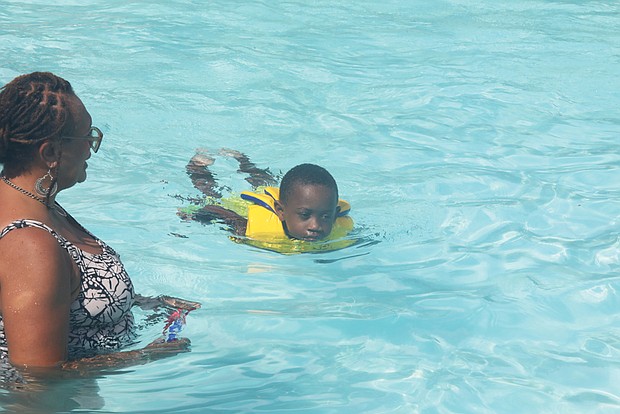 Loretta Lawrence and her grandson, Khalif Fitch, 5, enjoyed some Labor Day splashes Monday at Battery Park Pool on Richmond’s North Side.
