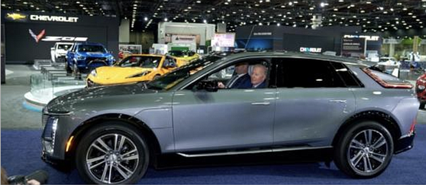 President Joe Biden driving GM vehicle at 2022 Detroit Auto Show