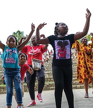 Cousins Neyia Hamilton, Joseph McDonough, and Keilani Jones took to the dance floor with their grandmother, Ayo Dowl, during Afro Fest RVA on Sept. 10 in Dogwood Dell. The theme “One Voice, One People, Many Cultures” included performing artists, a colorful “Parade of Nations” featuring 54 countries and nations, food, vendors, health screenings, a history tent, and children’s play area.