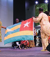 Representatives from the African nation of Togo participate in the parade of countries.
