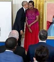 Former President Obama and his wife, former First Lady Michelle Obama, are shown at the unveiling of their official White House portraits during a ceremony Sept. 7 in the East Room of the White House.
