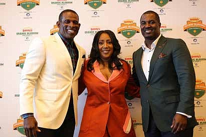 JSU Deion Sanders, Orange Blossom Classic Committee Executive Director Kendra Bulluck-Major, FAMU Coach Willie Simmons. Photo by Ernest Nelfrard