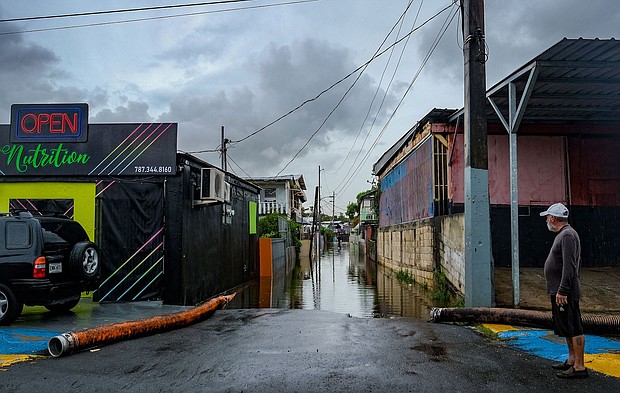 More than 1 million were left without running water after Hurricane Fiona ripped through the Dominican Republic. A man is pictured here looking at a flooded street in the Juana Matos neighborhood of Catano, Puerto Rico, after Hurricane Fiona passed through.
Mandatory Credit: -/AFP/Getty Images