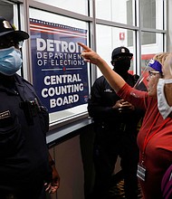 Police officers are seen outside the room where absentee ballots for the 2020 general election were counted on November 4, 2020 in Detroit, Michigan. The DHS rejected a plan to protect election officials from harassment ahead of the midterm elections.
Mandatory Credit:	Jeff Kowalsky/AFP/Getty Images