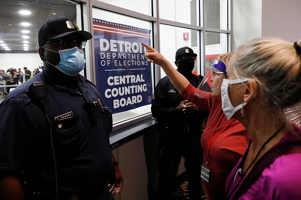 Police officers are seen outside the room where absentee ballots for the 2020 general election were counted on November 4, 2020 in Detroit, Michigan. The DHS rejected a plan to protect election officials from harassment ahead of the midterm elections.
Mandatory Credit: Jeff Kowalsky/AFP/Getty Images