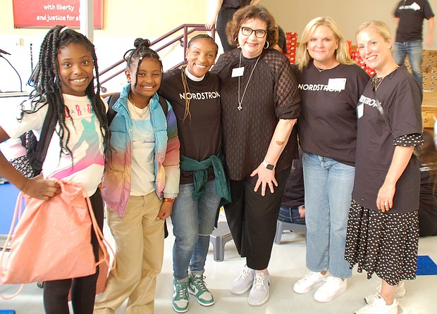King Elementary students pose with soccer star Crystal Dunn, Amy Fass, CEO of Shoes That Fit, Tacey Powers, Executive Vice President, General Merchandising Manager at Nordstrom and Jen Ewell, Brand Marketing Director at Nike. Photo Credit: Shawntell Washington