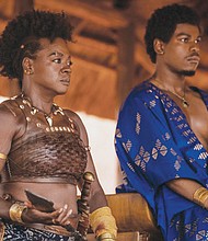 General Nanisca (Viola Davis) leads a military regiment that serves at the pleasure of young King Ghezo (John Boyega) in “The Woman King."
