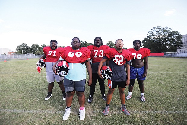 Thomas Jefferson High School Vikings’ offensive line pause for a portrait during a Sept. 14 practice on their home field. They are from left: Jaden Goodwin, senior; Cory Winston, senior; Zavier Artis, sophomore; Deon Wright, sophomore; and Zyan Hill, sophomore. Missing from the Viking lineup, Timarion “T-Rex” Venable, a junior.