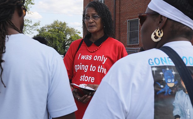 Karen Regina Cheatham, center, grandmother of Tynashia, speaks with friends and supporters who share her grief. Numerous Richmond officials and leaders also participated in the march including members of Richmond City Council, Richmond Police Chief Gerald Smith, Richmond Redevelopment and Housing Authority’s new director, Steven Nesmith, Richmond School Board President Shonda Harris-Muhammed and other families who have lost their children to gun violence in the Richmond area. One arrest has been made in the death of Tynashia.