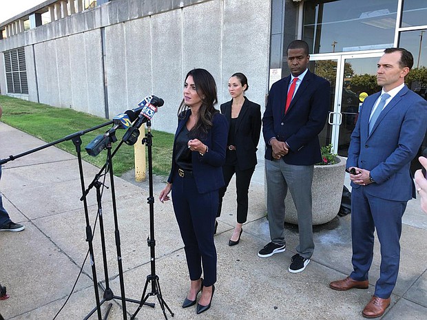 ttorney Alexandra Benevento, center, speaks with reporters Tuesday during a news conference announcing a cheerleader abuse lawsuit filed in Tennessee.