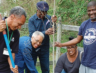 Members of Branch’s Baptist Church help plant a tree on the church property in 2018.