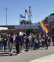 Students at McLean High School in McLean, Va., walk out of classes Tuesday. They joined student activists who walked out of schools across Virginia to protest Republican Gov. Glenn Youngkin’s proposed changes to the state’s guidance on district policies for transgender students that would roll back some accommodations.