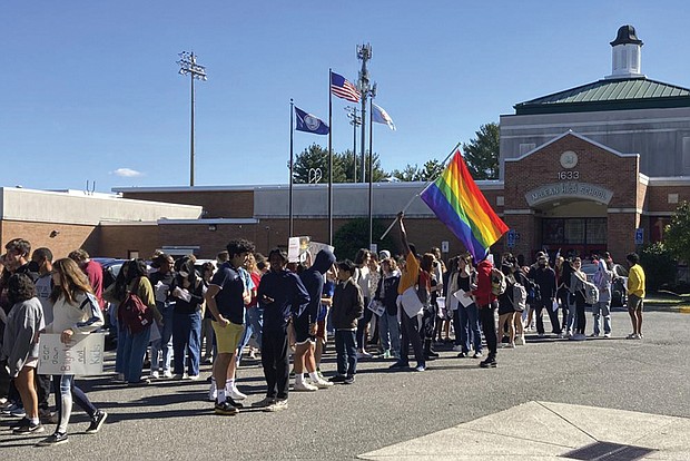 Students at McLean High School in McLean, Va., walk out of classes Tuesday. They joined student activists who walked out of schools across Virginia to protest Republican Gov. Glenn Youngkin’s proposed changes to the state’s guidance on district policies for transgender students that would roll back some accommodations.
