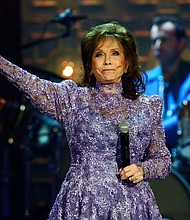 Dolly Parton, Martina McBride, and other celebrities react to death of country singer Loretta Lynn, seen here in September 2014, in Nashville, Tennessee.
Mandatory Credit:	Mark Zaleski/AP