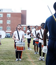 Members of Virginia State University’s Marching Band practice music and high-stepping routines that they will showcase during the school’s homecoming game this weekend. Taylor Whitehead is the interim band director for Virginia State University’s 120-member marching band, known as “The Trojan Explosion.” Drum major Juwan L. Walton, a junior from Franklin, keeps a trained eye on his fellow bandmates.