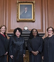 In this image provided by the Supreme Court, from left, Associate Justice Amy Coney Barrett, Associate Justice Sonia Sotomayor, Associate Justice Ketanji Brown Jackson, and Associate Justice Elena Kagan stand in the Justices’ Conference Room on Sept. 30 prior to the formal investiture ceremony for Justice Jackson at the Supreme Court in Washington.