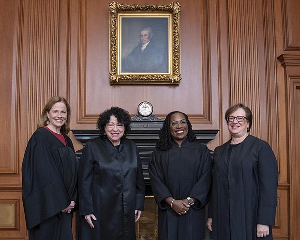 In this image provided by the Supreme Court, from left, Associate Justice Amy Coney Barrett, Associate Justice Sonia Sotomayor, Associate Justice Ketanji Brown Jackson, and Associate Justice Elena Kagan stand in the Justices’ Conference Room on Sept. 30 prior to the formal investiture ceremony for Justice Jackson at the Supreme Court in Washington.