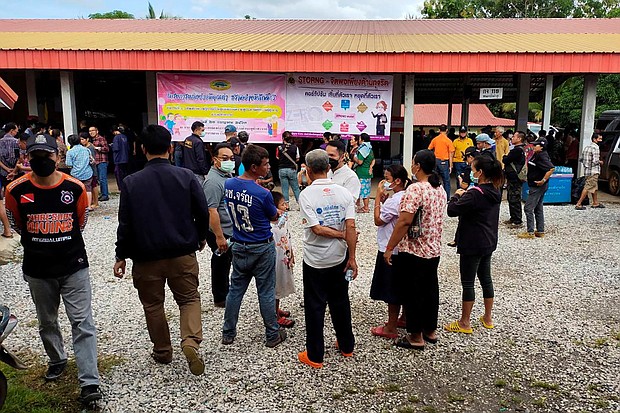 At least 22 children were among 34 people killed in a mass shooting at a child care center in northeastern Thailand on October 6. People are seen here gathering outside the center in the Thai town of Uthai Sawan, Nong Bua Lamphu province.
Mandatory Credit:	Sakdipat Boonsom/Reuters