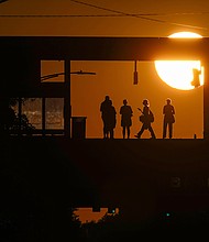 US economy will soon start losing 175,000 jobs a month, Bank of America warns. In this image, commuters are pictured at Addison Station in Chicago on September 19.
Mandatory Credit:	Kiichiro Sato/AP