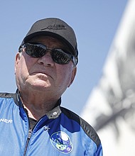 Actor William Shatner speaks to the media after his flight in a capsule powered by Blue Origin near Van Horn, Texas, in October 2021. Shatner had a very distinct observation when he turned his gaze from the Earth to black expanse of the cosmos.
Mandatory Credit:	Mike Blake/Reuters
