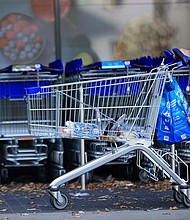 A customer pushes a shopping cart and bags outside a supermarket operated by Aldi Einkauf GmbH & Co., also known as Aldi Nord, in central Berlin, Germany, on Tuesday, Oct. 4.
Mandatory Credit:	Krisztian Bocsi/Bloomberg/Getty Images